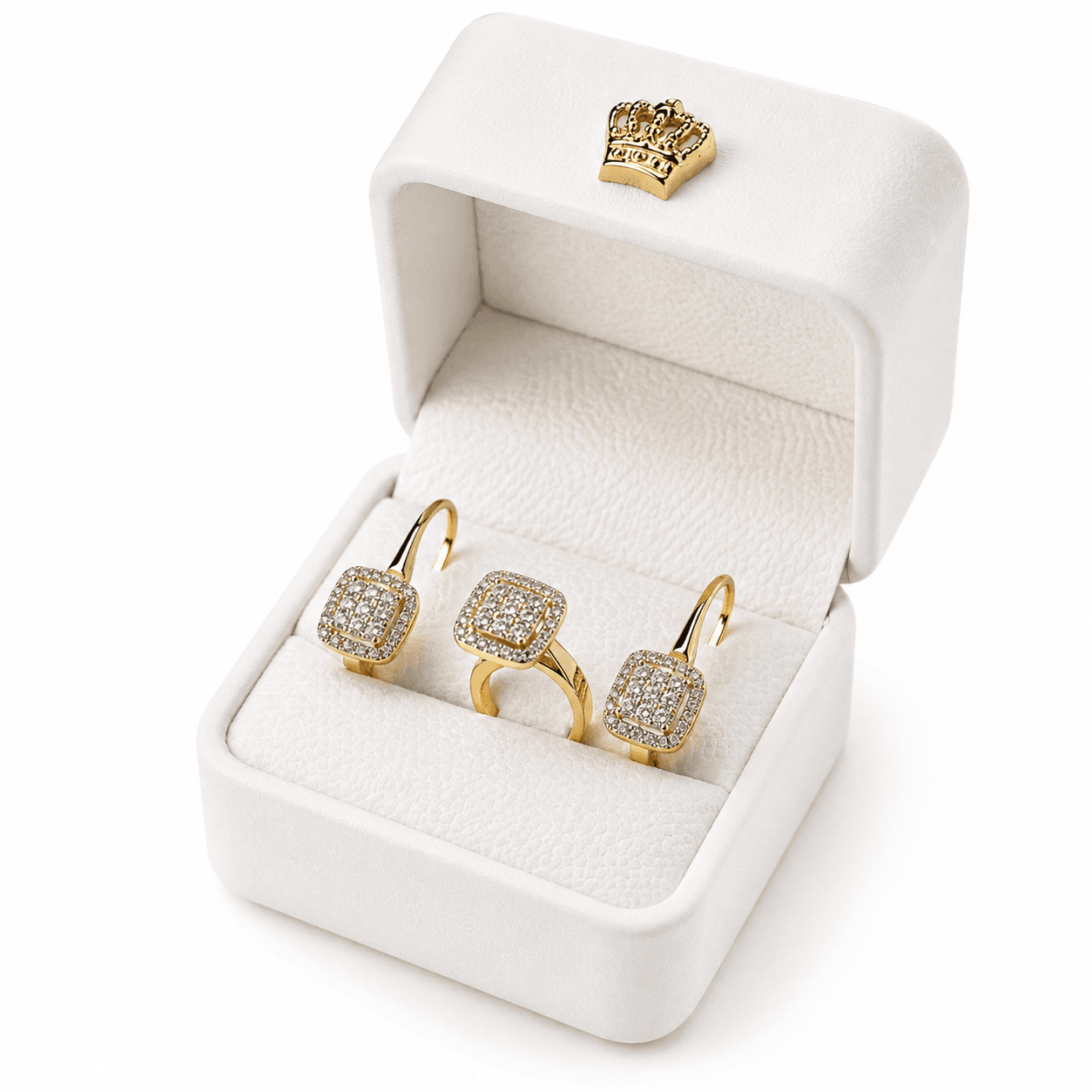 Gold ring and matching earrings with square diamond clusters inside an open white jewelry box.